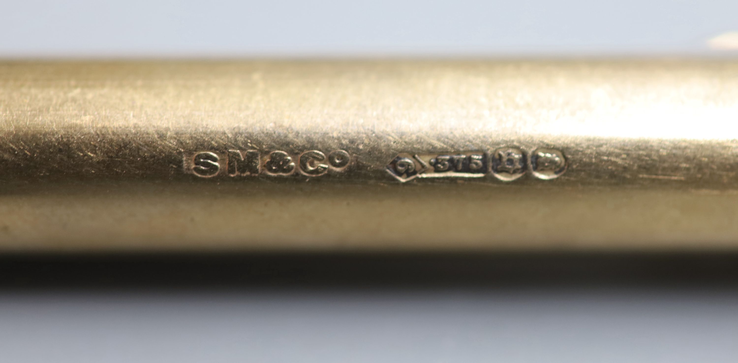 A George V 9ct gold cased pencil by Sampson Mordan & Co, 75mm, gross 18.3 grams.